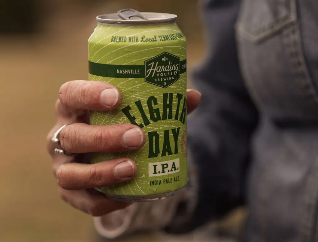 Pouring a beer into a glass.