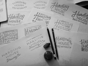Logo Examples on Sheets of Paper for Harding House